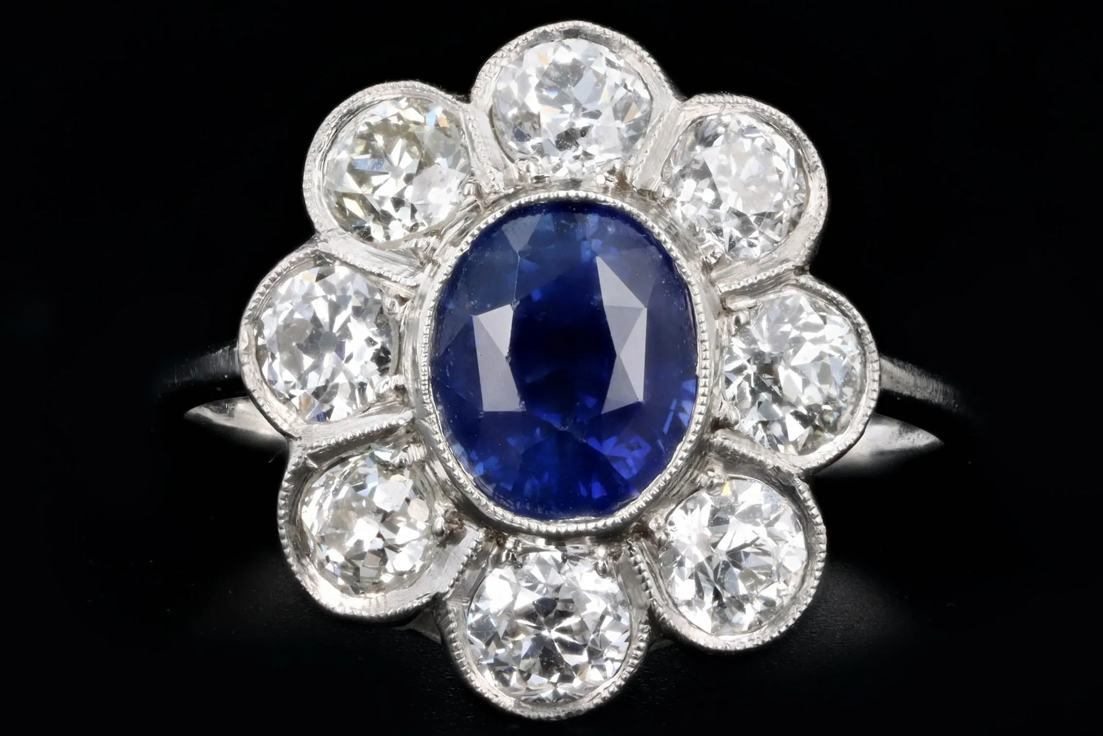 Art Deco Inspired Platinum 2.21 Carat Oval Cut Natural Sapphire & Old European Cut Diamond Halo Cluster Ring