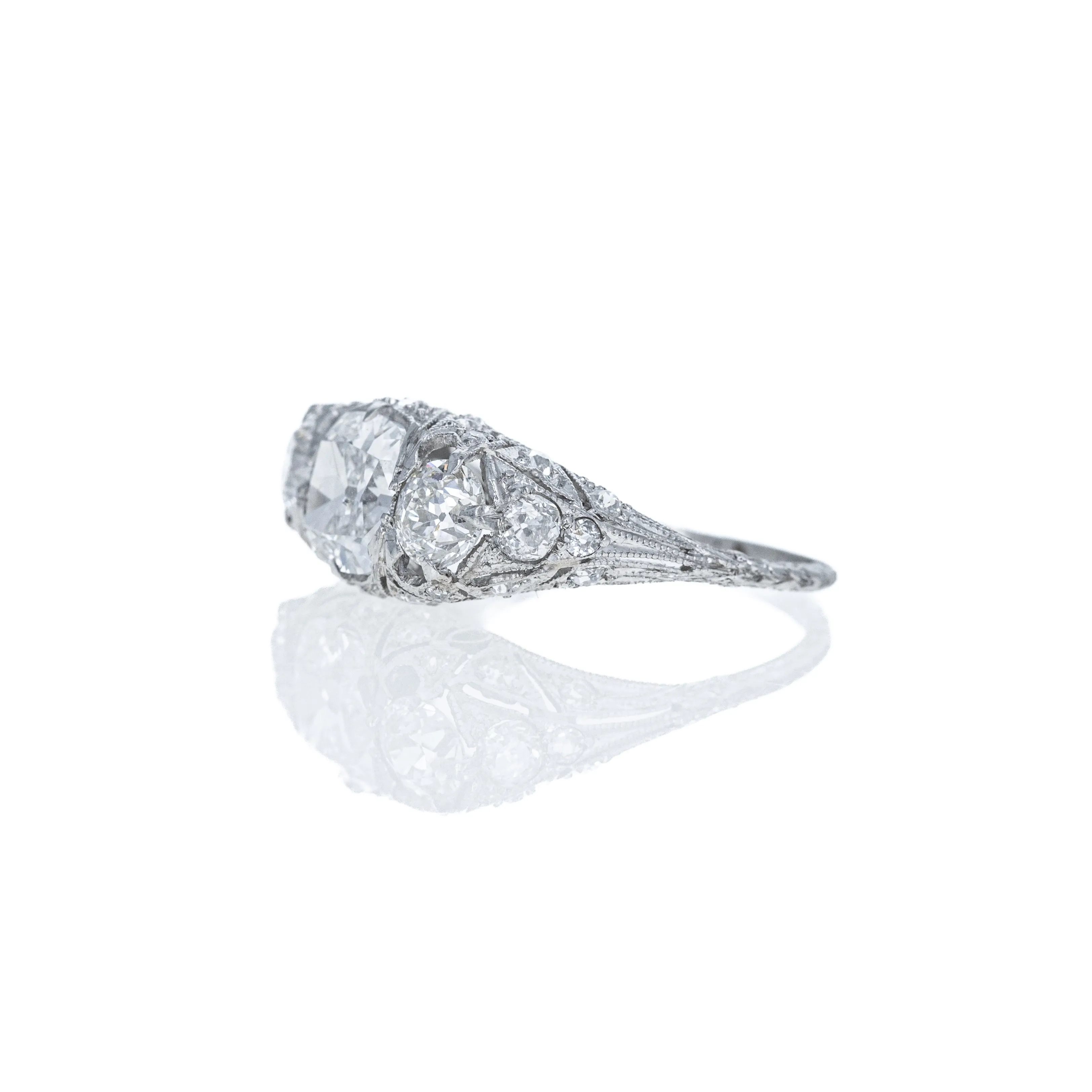 Art Deco Platinum 1.51 Carat Old Mine Diamond Three Stone Filigree Ring