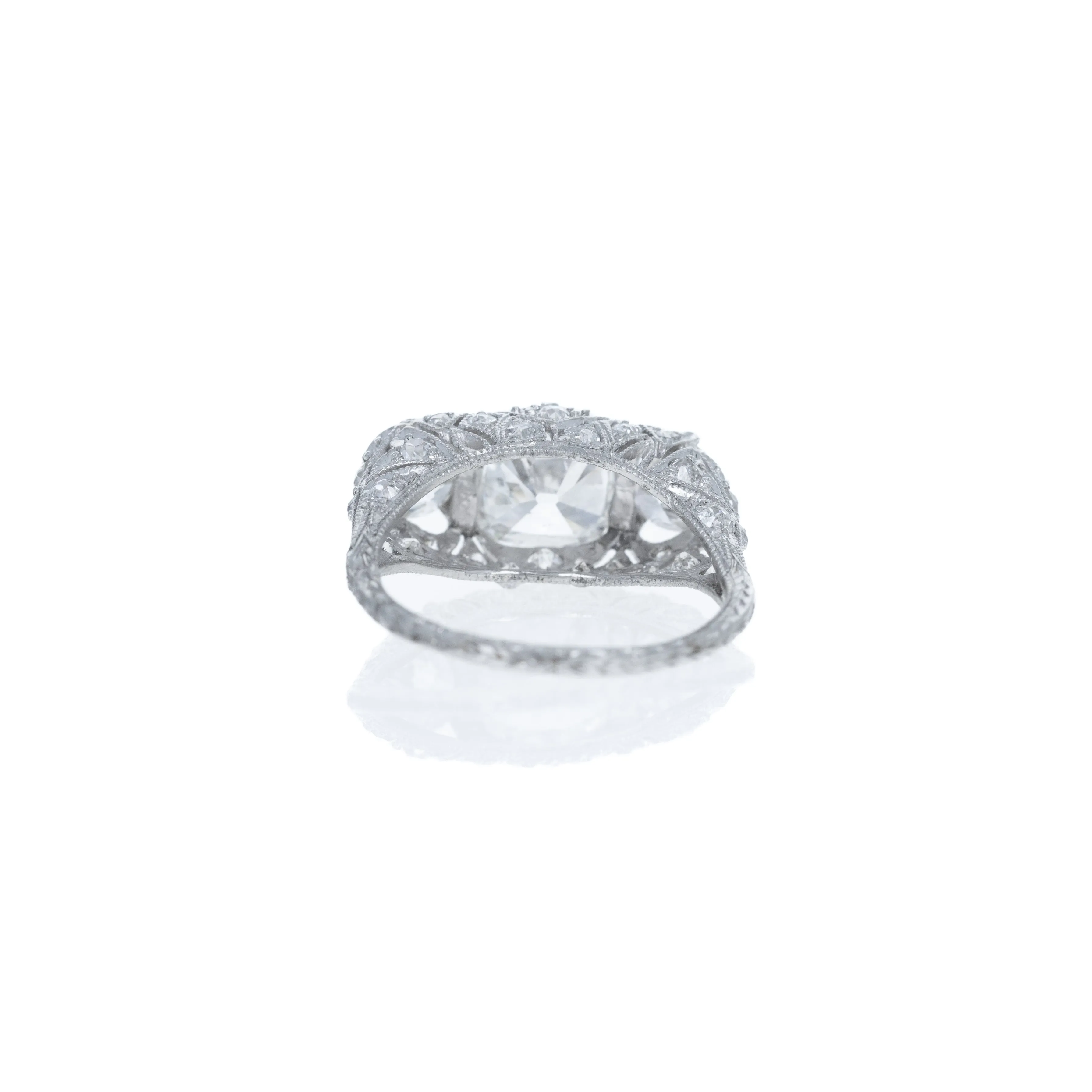 Art Deco Platinum 1.51 Carat Old Mine Diamond Three Stone Filigree Ring