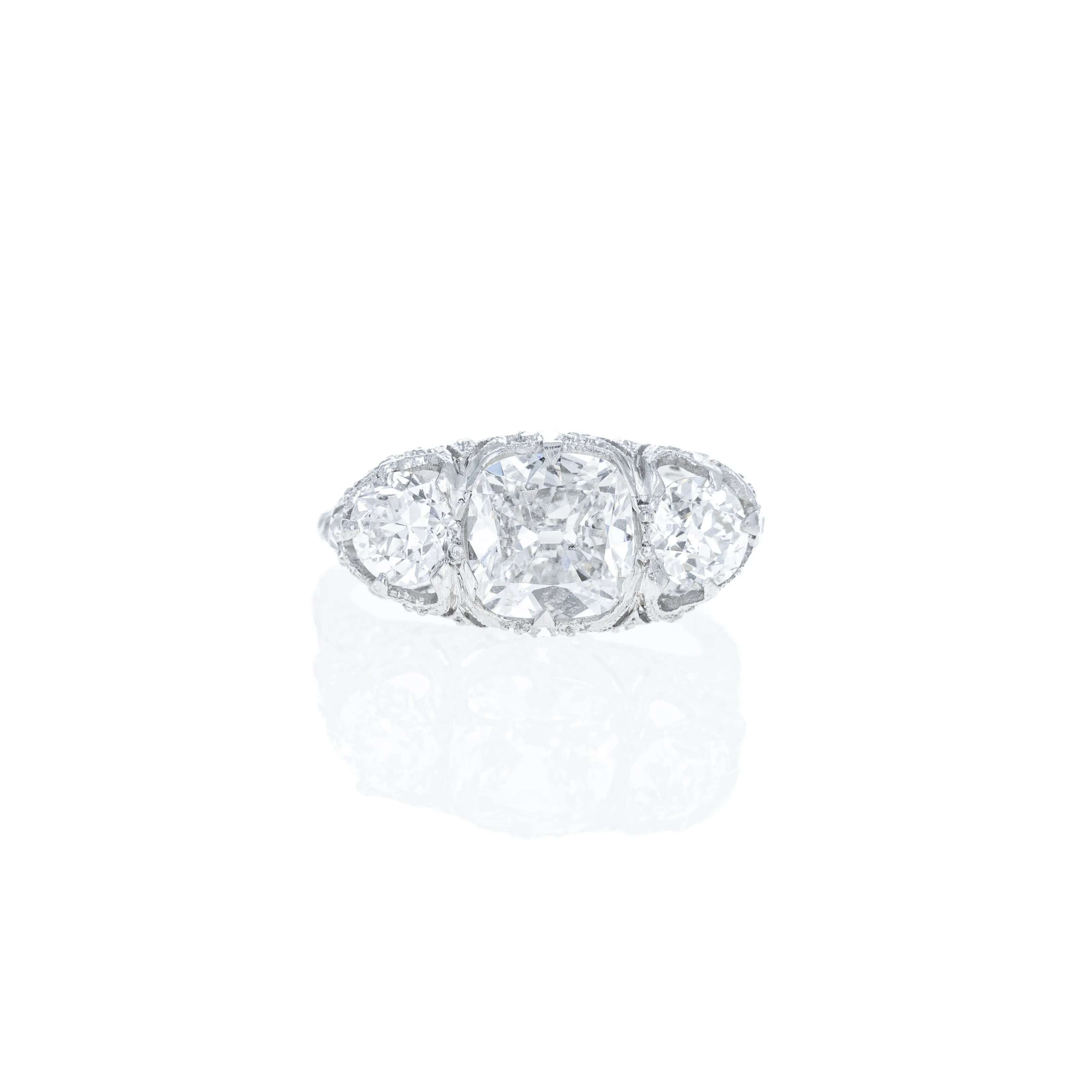 Art Deco Platinum 1.51 Carat Old Mine Diamond Three Stone Filigree Ring