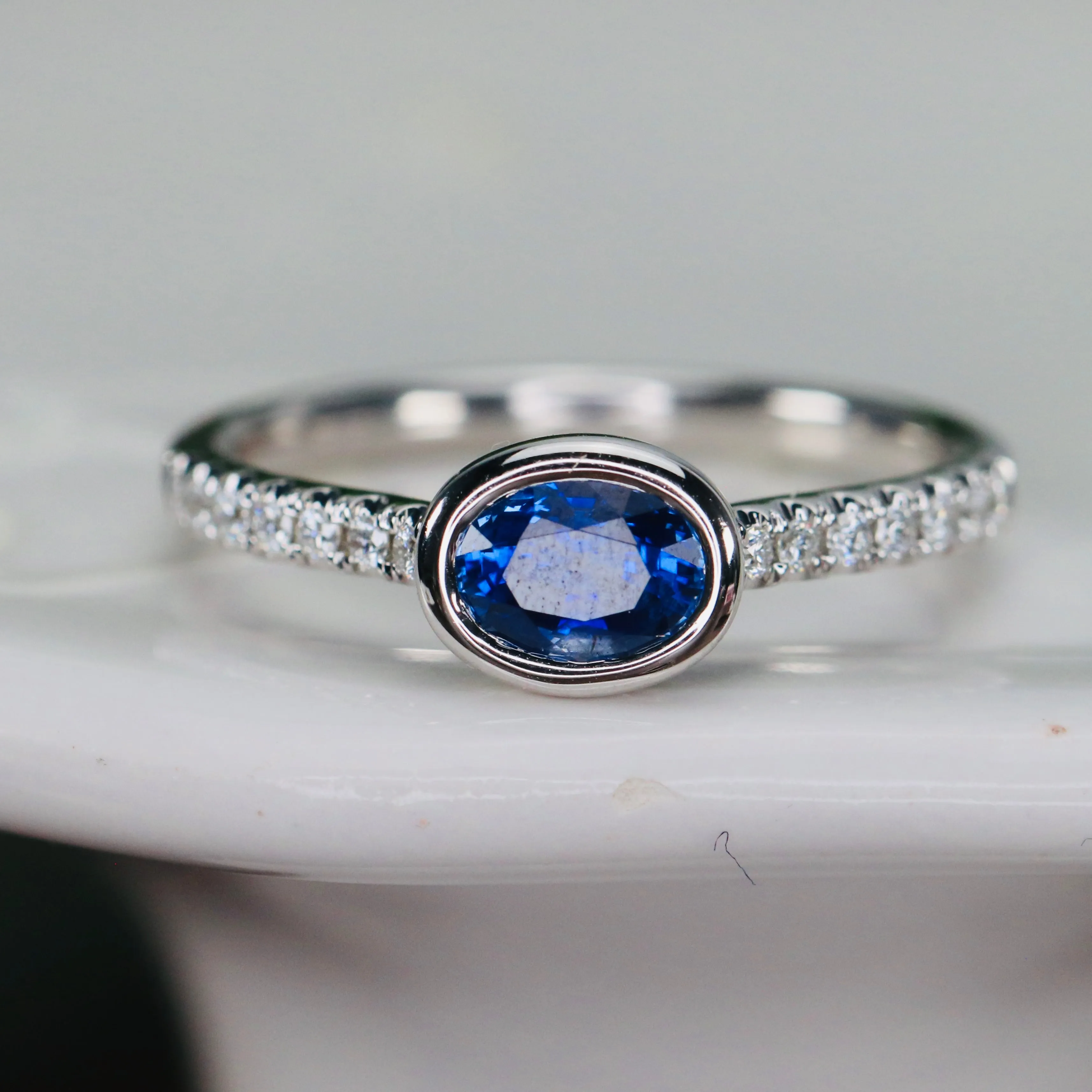 East west blue Sapphire and diamond ring in 14k white gold