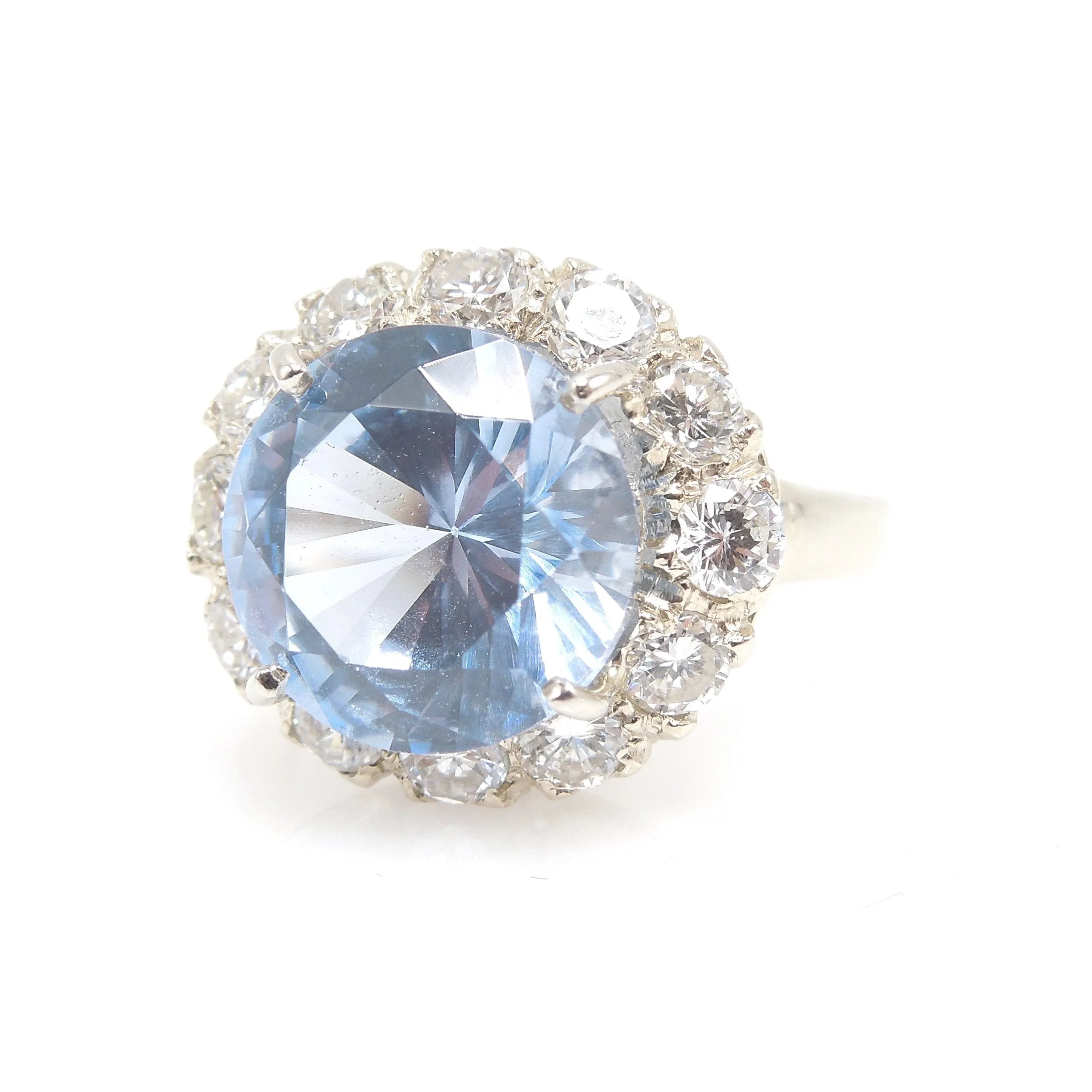 Large Round Blue Spinel Ring Surrounded by Diamond Halo in White Gold