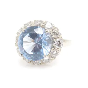 Large Round Blue Spinel Ring Surrounded by Diamond Halo in White Gold