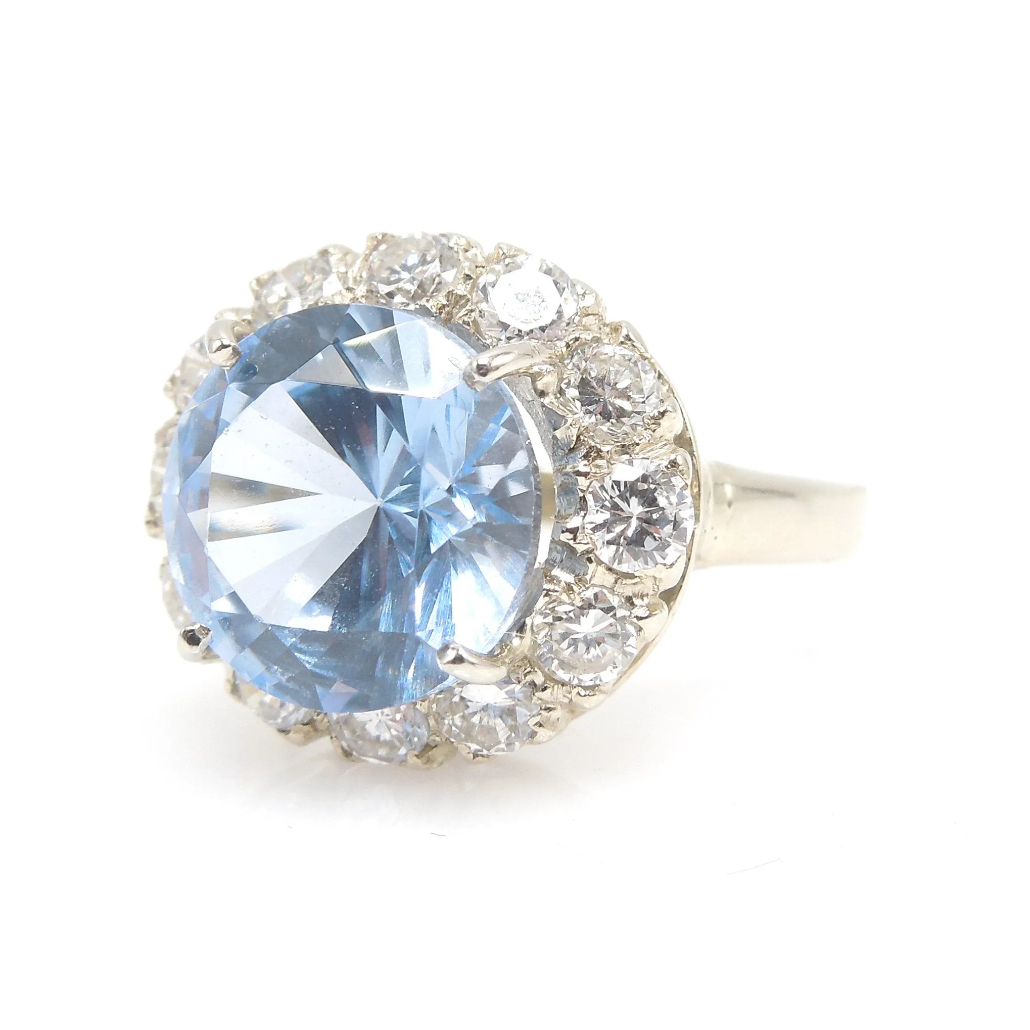 Large Round Blue Spinel Ring Surrounded by Diamond Halo in White Gold