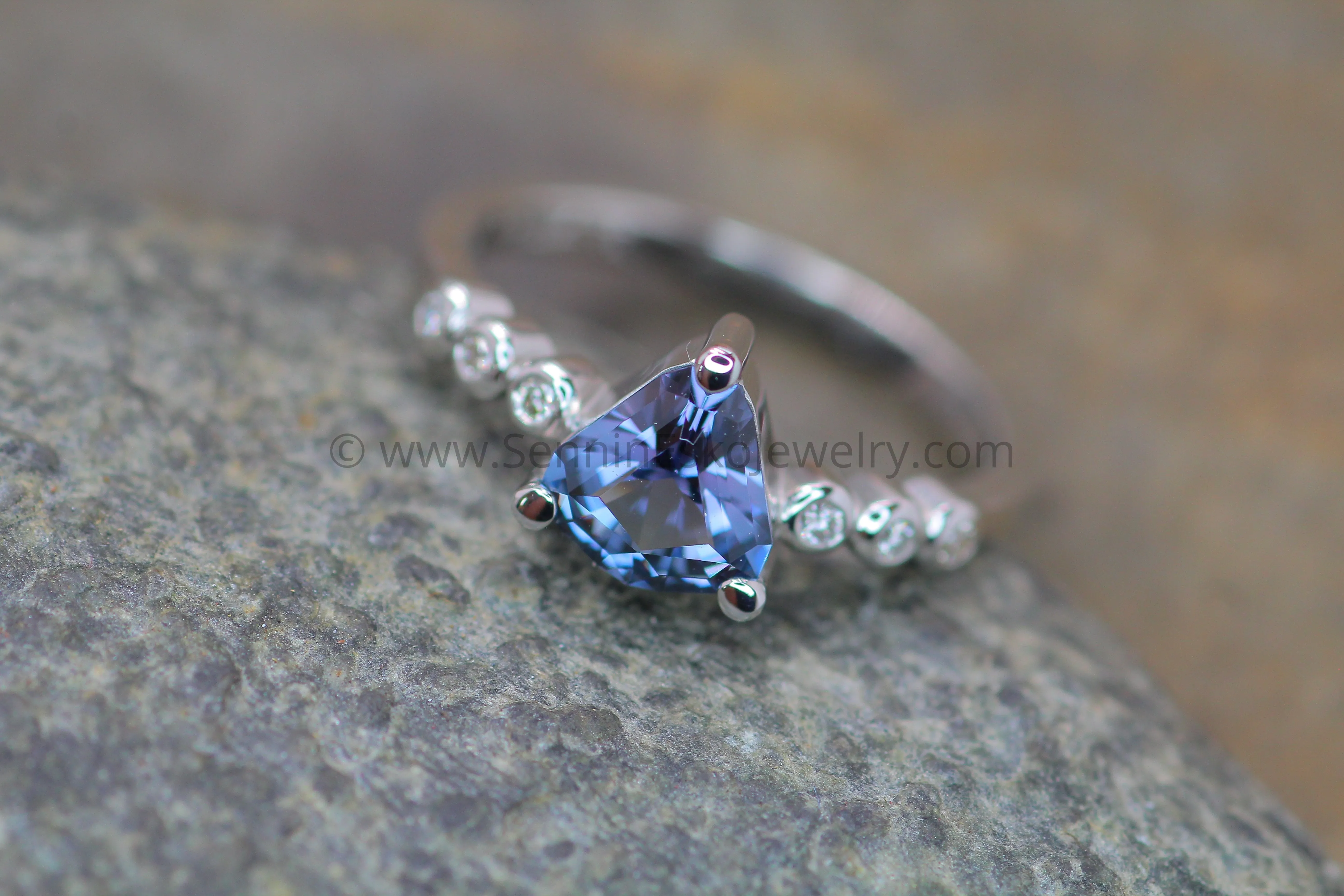 Seven Stone Diamond Accented Prong Platinum Setting - Depicted with a Lilac Spinel (Setting Only, Center Stone Sold Separately)