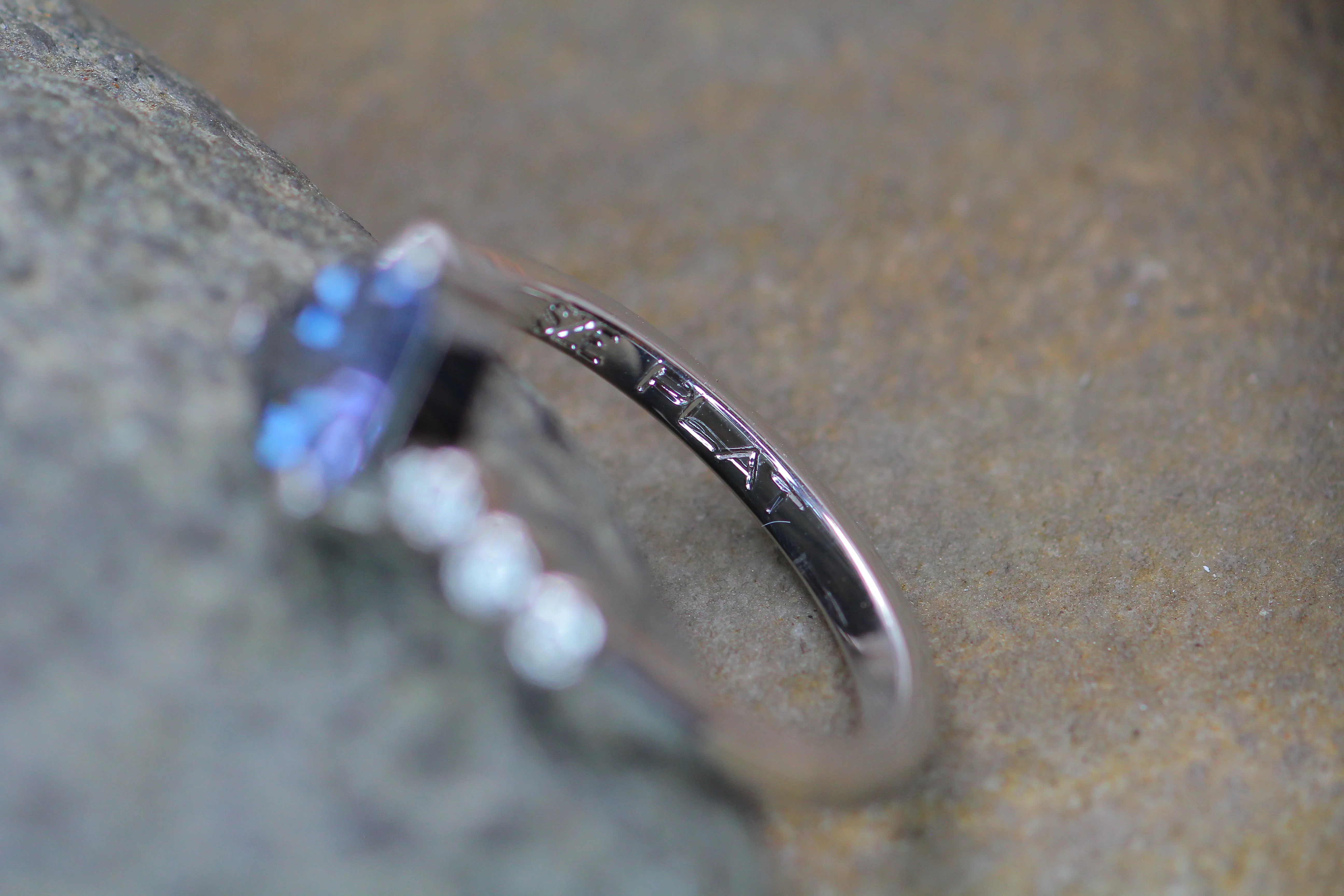 Seven Stone Diamond Accented Prong Platinum Setting - Depicted with a Lilac Spinel (Setting Only, Center Stone Sold Separately)