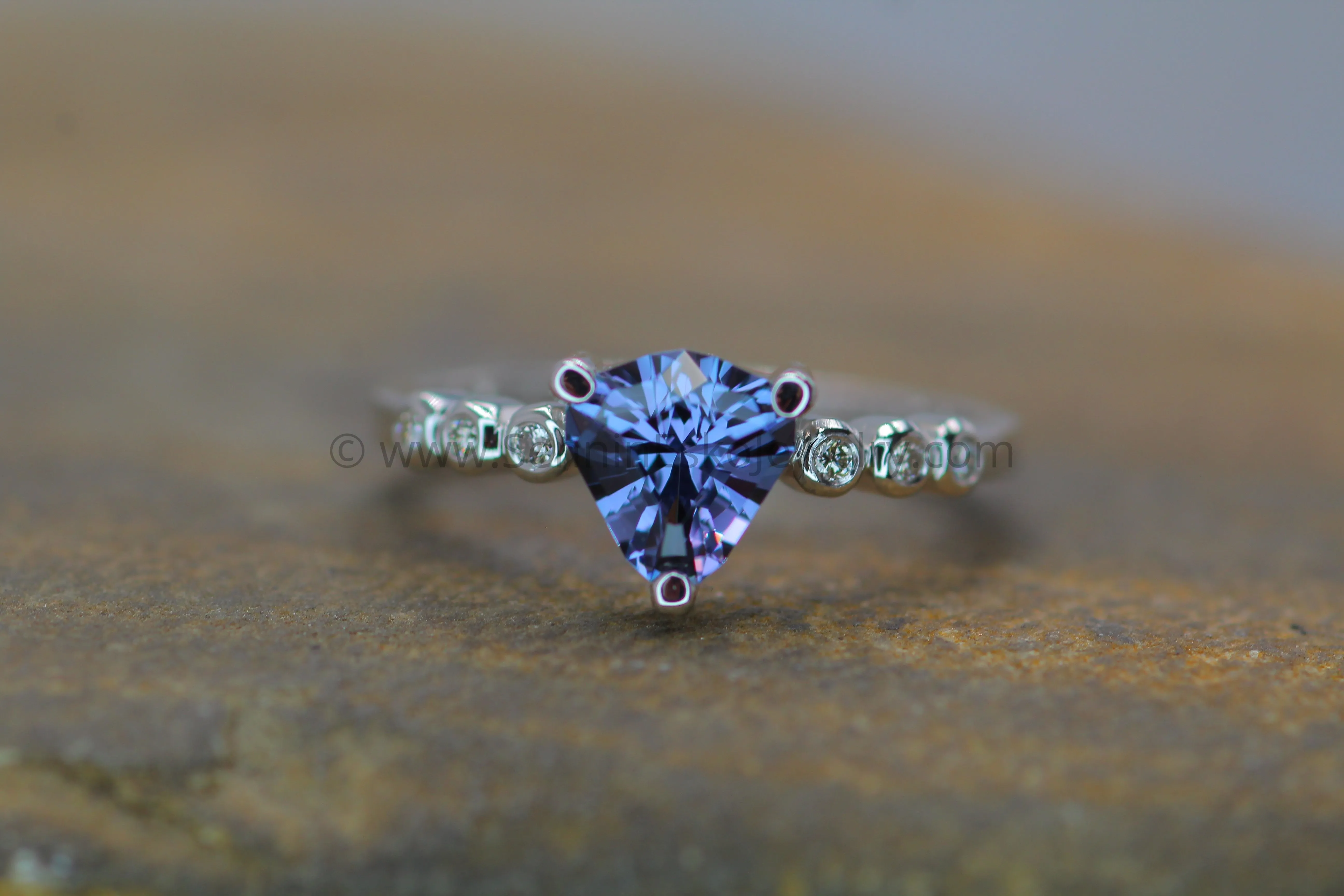 Seven Stone Diamond Accented Prong Platinum Setting - Depicted with a Lilac Spinel (Setting Only, Center Stone Sold Separately)