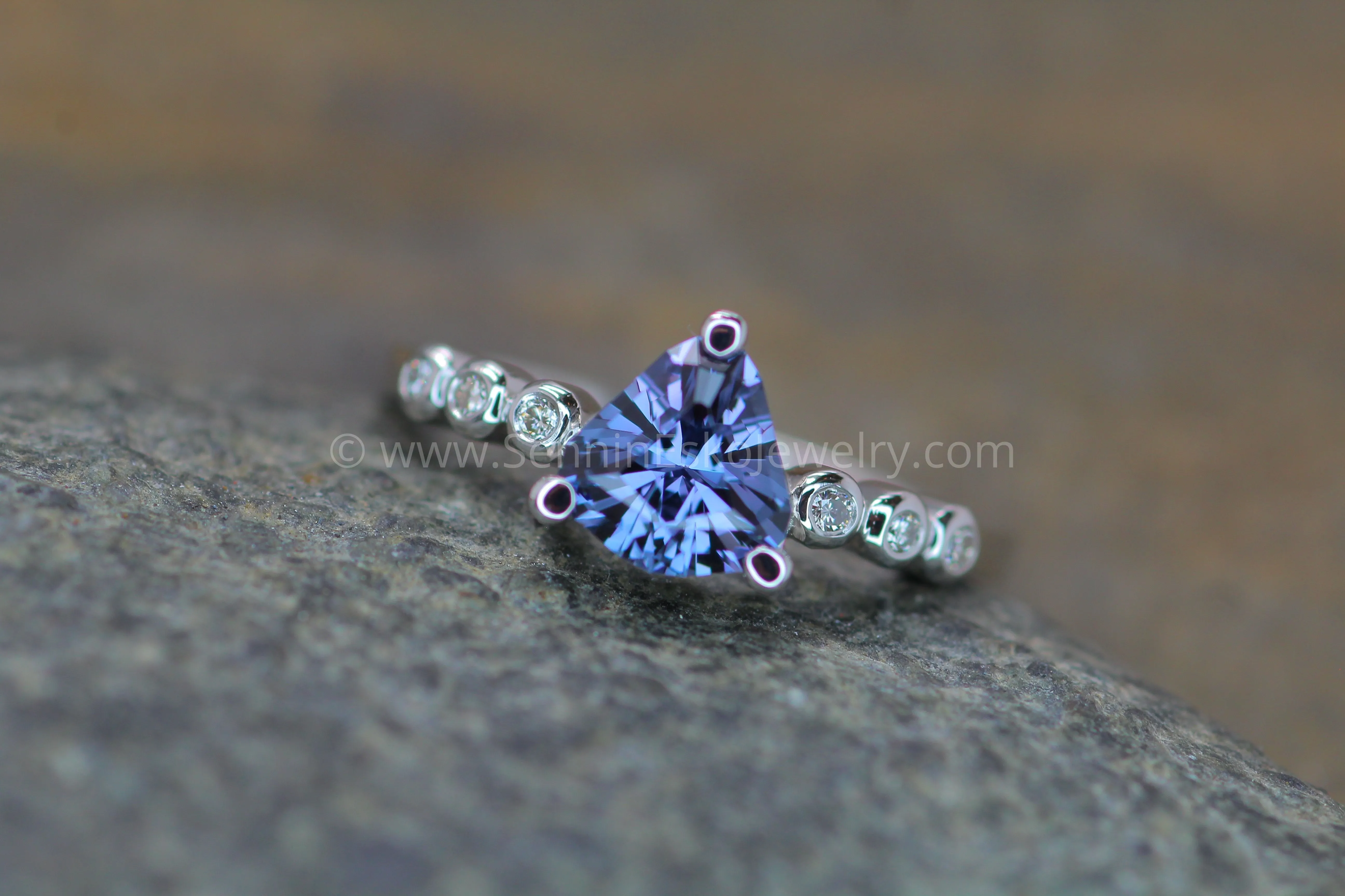 Seven Stone Diamond Accented Prong Platinum Setting - Depicted with a Lilac Spinel (Setting Only, Center Stone Sold Separately)
