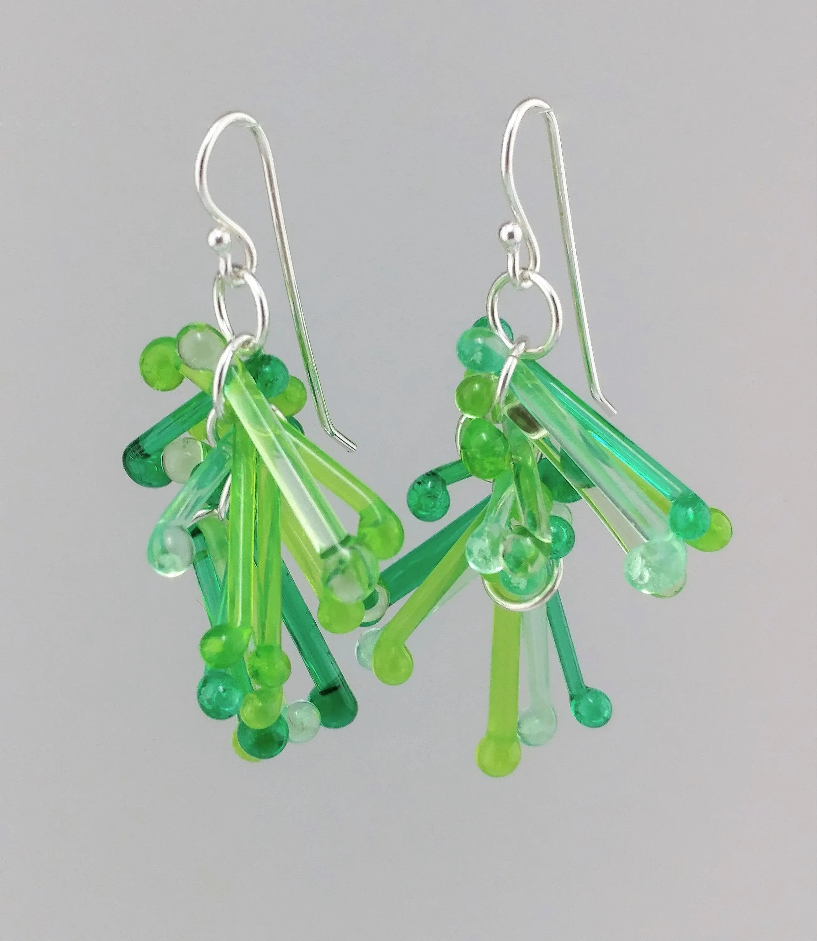 Shades of Green Kinetic Earrings of Lampwork Glass Jack with sterling silver ear wires.