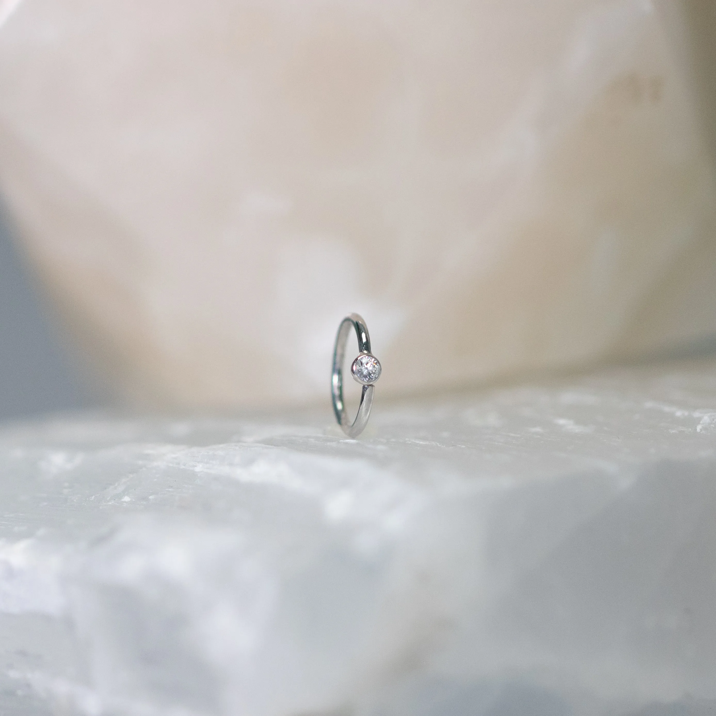 Vertical Fixed Bead Ring with CZ Bezel