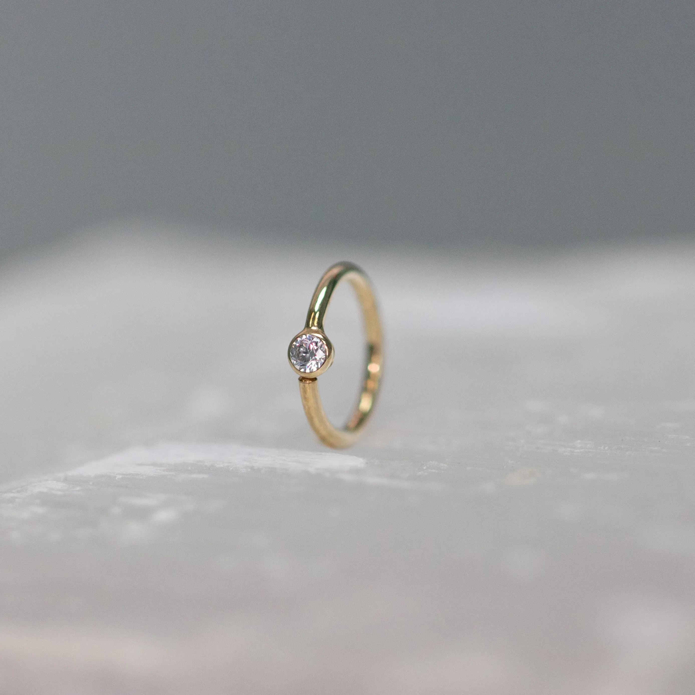 Vertical Fixed Bead Ring with CZ Bezel