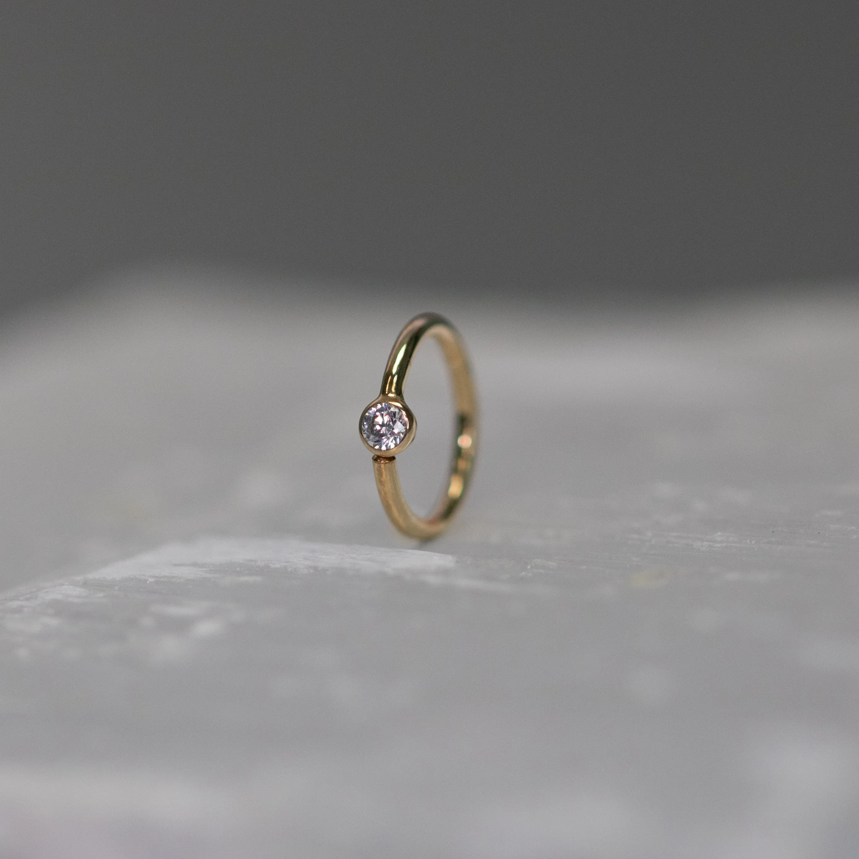 Vertical Fixed Bead Ring with CZ Bezel