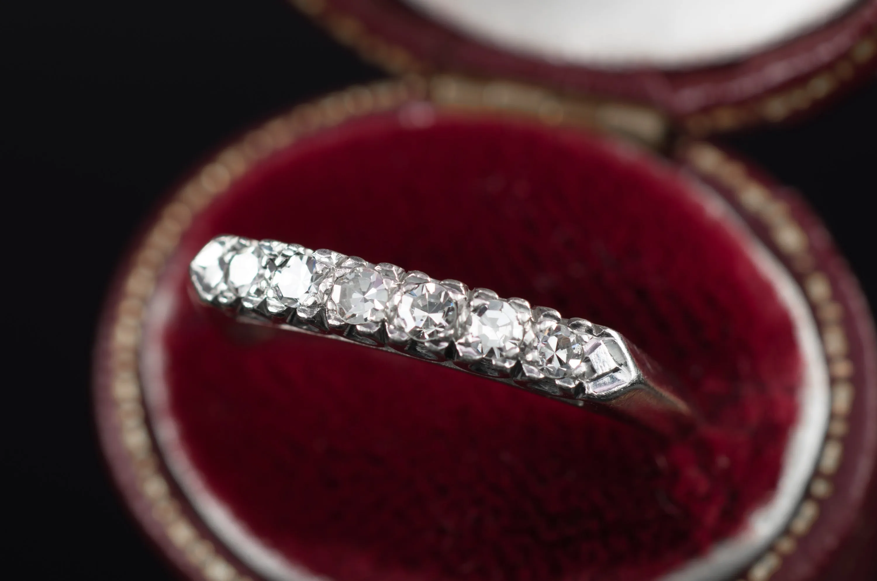 VINTAGE PLATINUM AND SINGLE CUT DIAMOND HALF BAND