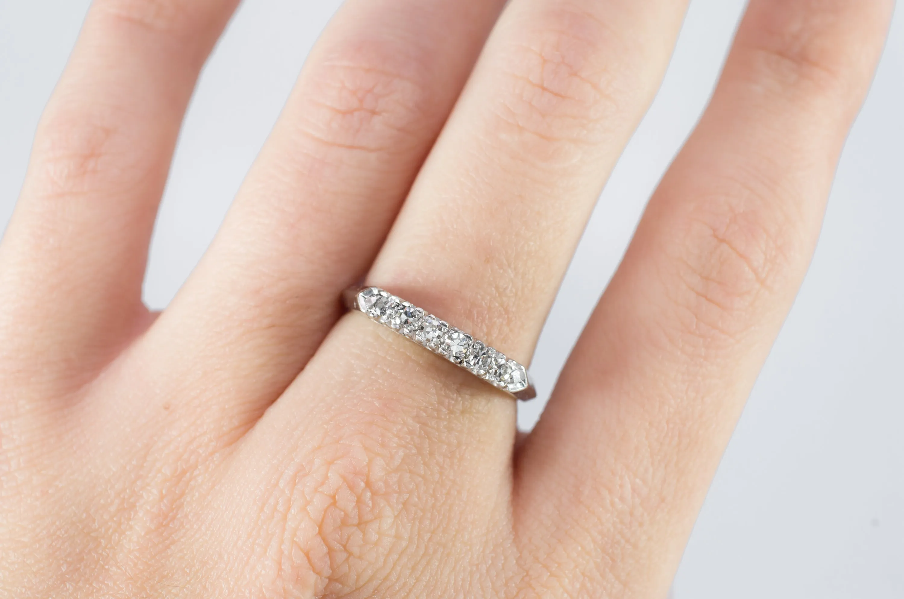 VINTAGE PLATINUM AND SINGLE CUT DIAMOND HALF BAND
