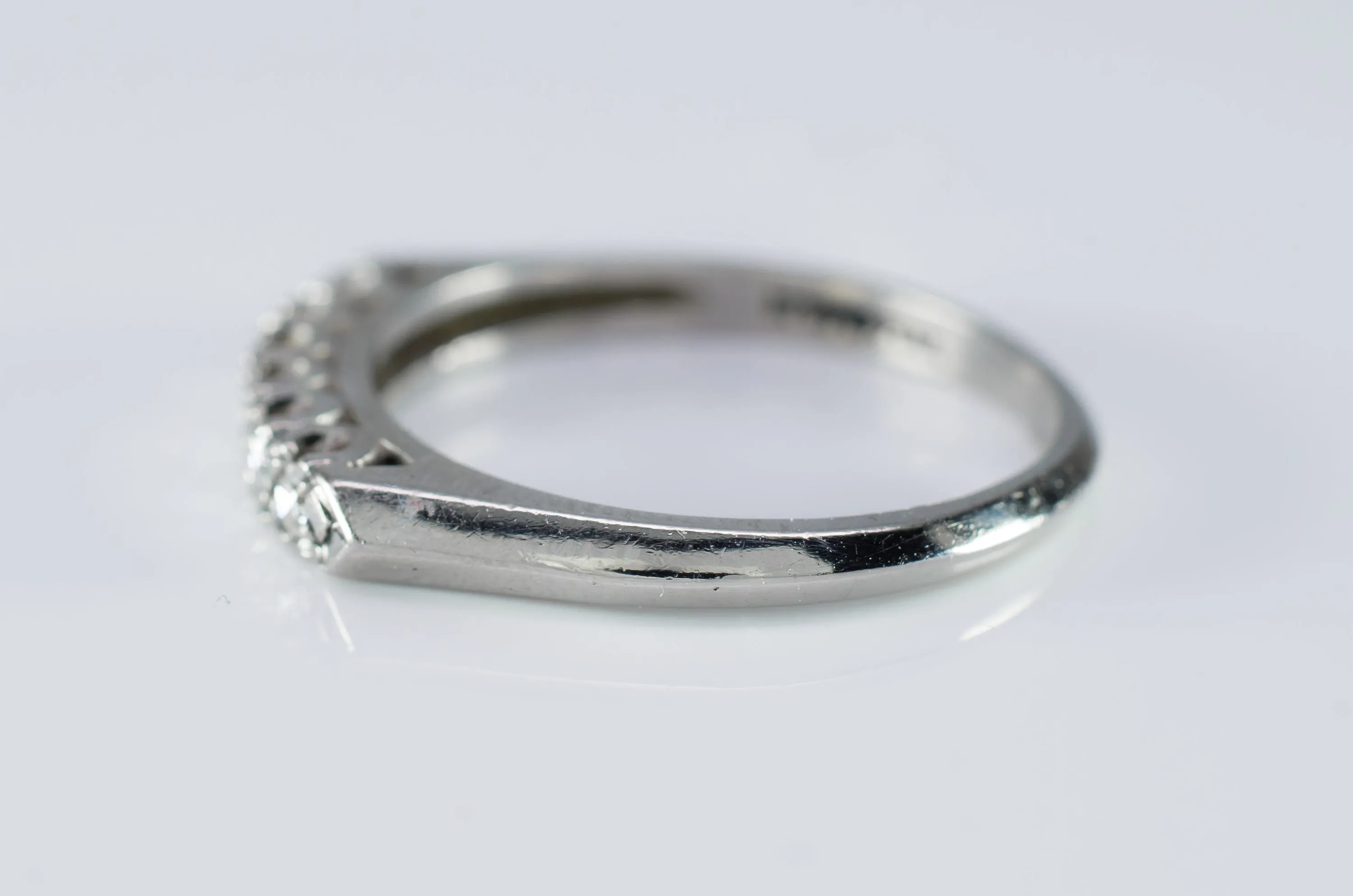 VINTAGE PLATINUM AND SINGLE CUT DIAMOND HALF BAND